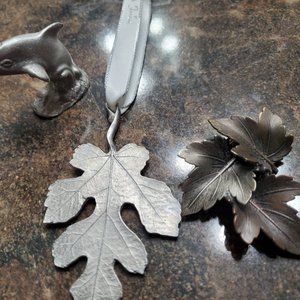 Pewter dolphin, leaf lapel pin and leaf hanging ornament.